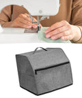 Oxford Cloth Sewing Machine Dust Cover With Accessories Pouch shown under a sewing machine in use.