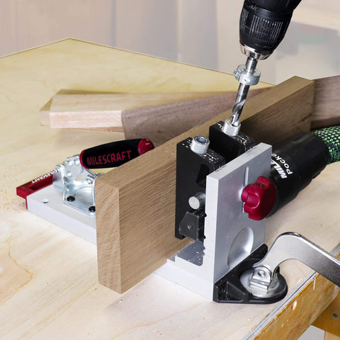 Pocket Hole Jig 400 Self Clamping Kit With Adjustable Bushing Blocks and drill guides being used on wood board