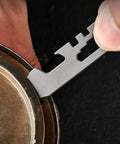 Ultra Lightweight Metal Alloy Multitool With Wrenches And Bottle Opener used on a bottle cap, pocket-sized 6x1.5cm tool