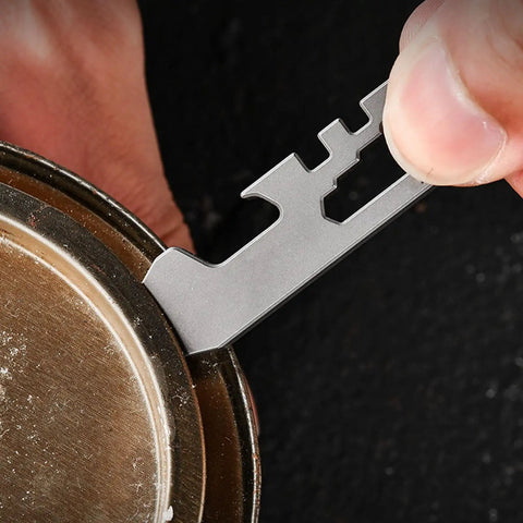 Ultra Lightweight Metal Alloy Multitool With Wrenches And Bottle Opener used on a bottle cap, pocket-sized 6x1.5cm tool
