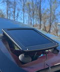 Five Watt Solar Panel 12V Battery Charger With Charge Controller IP67 Weatherproof mounted on car windshield with suction cups
