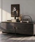 Living room sideboard with artwork and decor, featuring vintage brass cabinet knobs with backplates for kitchen and dresser cabinets.