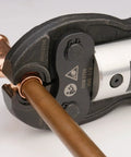 Close-up of ProPress tool crimping 12 Pack 1/2 Inch Copper Press Fittings Kit for leak-free water piping installation.