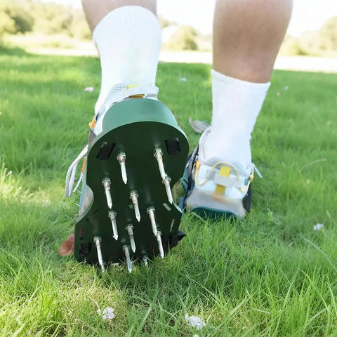 Person walking on grass wearing lawn aerator shoes for grass health with adjustable straps and heavy duty spikes one size fits all