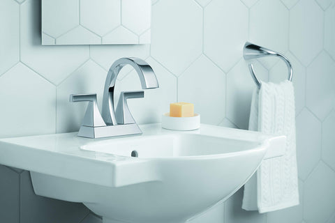 Veer Pedestal Bathroom Sink With 4 Inch Centerset Faucet Holes, 24 Inch Width, Sandbar Finish, seen with toiletries on side deck