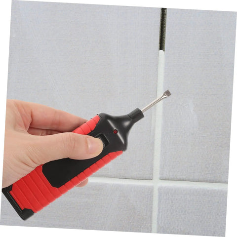 Hand uses tool from Tile Repair Kit For Porcelain And Marble Color Wax Blocks For Quick Scratch Chip Repair on tile grout.