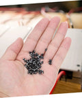 Hella Reliable 100 Piece SMD Rectifier Diode Pack Built Tough For High Voltage Circuits shown in a hand, ideal for automotive power supplies.