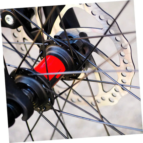 Fire Up Your Rig With This Mountain Bike Front And Rear Mechanical Disc Brake Kit Featuring Forged Aluminum Calipers Premounted Pads And Direct Pull Cables For Solid Stops On Wild Trails All Season Long with a close-up of a disc brake rotor and hub.