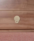 Brushed Brass Concealed Single Hole Cabinet Knobs and Drawer Pulls for Dresser and Closet Cabinets installed on wood drawer