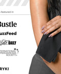 Woman using pocket sized sweat towels for face hands and body on the go quick dry microfiber handkerchiefs in black.