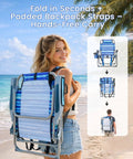 Woman carrying Two-Pack Backpack Beach Chairs with Cup Holder and Towel Bars, Ocean Blue, at beach.