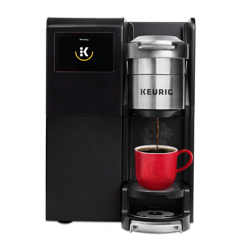 K-3500 Single Serve Commercial Coffee Maker for busy offices, brewing coffee into a red mug, touch screen display visible.