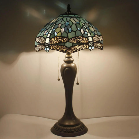 Lit Tiffany Style Sea Blue Dragonfly Stained Glass Table Lamp with light on, 12 inch shade, 22 inch tall, antique green bronze base