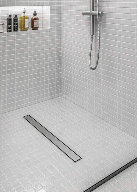 Heavy Duty 36 Inch Linear Shower Drain With Satin Stainless Steel Surface Mount Or Tile In Grate featuring sleek design in a modern bathroom setting.