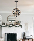 Cozy Rustic Farmhouse 4 Light Chandelier With Height Adjustable Design, wood frame, vintage white finish, hanging in living room.