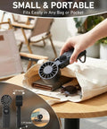 Portable Handheld USB Fan With 5000mAh Rechargeable Battery LED Display Foldable Design shown fitting into a tote bag