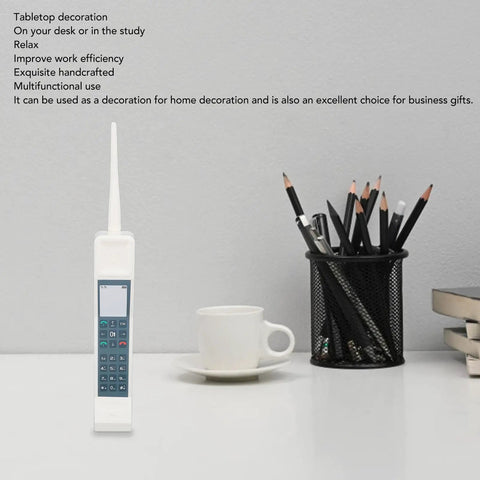Hella Nostalgic White Retro Brick Cell Phone Model Ornament For Office Desk Decor Vintage 80S 90S Throwback Piece on a desk.
