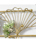 Close-up of decorative gold wall mounted coat rack with green leaf design, part of Heavy Duty Wall Mounted Coat Rack With Sturdy Hooks For Draping Jackets Hats And Outerwear In The Entryway Hallway Bedroom A Simple Setup That Keeps Your Daily Gear Straight Up Tidy.