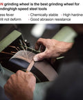 Person using CBN grinding wheel on high-speed steel tool for sharpening, highlighting stable and abrasion-resistant features.