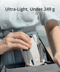 Person holding Mini 3 Fly More Combo Plus With RC Included Foldable Camera Drone, compact design under 249g.