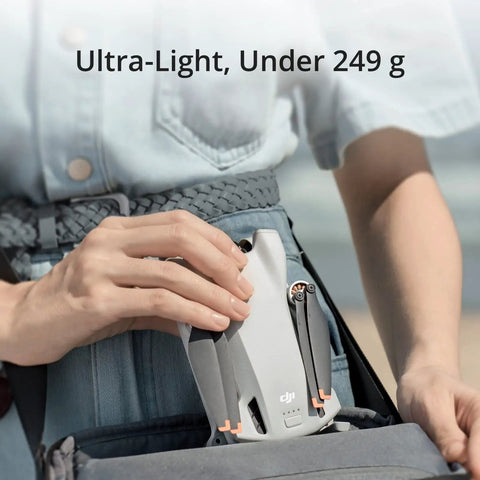 Person holding Mini 3 Fly More Combo Plus With RC Included Foldable Camera Drone, compact design under 249g.
