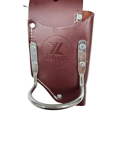 Close-up of Two-In-One Leather Tool Holder for Carpenters and Electricians with steel hammer loop, brown leather material.