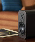 RB42 Reference Bookshelf Speakers With 4 Inch Woofer And Silk Tweeter, Dark Walnut Pair on wooden table in living room