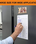 Person using Heavy Duty Magnetic Sheets With Adhesive Backing For Photos And Stickers 12 By 8.5 Inch A4 Large Cuttable Magnet Sheets Extra Strong Durable Fridge And Cabinet Magnets 4 Pack on fridge