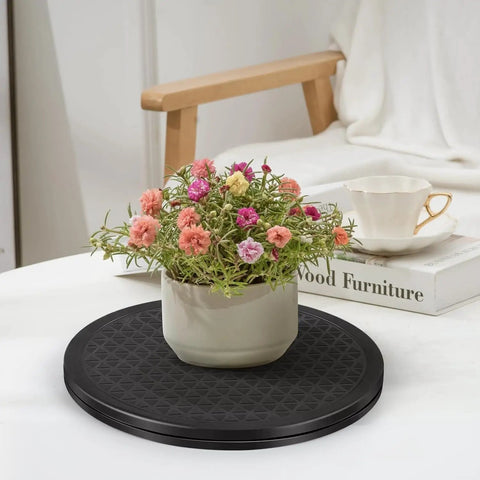 Potted plant on 12 Inch Rotating Turntable With Steel Ball Bearings For Flat Panel Monitors TVs Potted Plants And Stereo Speakers A Versatile Heavy Duty Black Swivel Stand For Home Office Desk Or Display Setup.