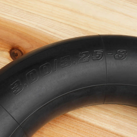 3.00-8 Inner Tube With TR87 Angled Stem on wooden background, showing tire size marking