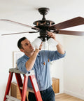 Man installing Rock Solid 30 Piece Full Replacement Ceiling Fan Blade Screws With 1/4-20 Threading And Premium Bronze Pan Heads.