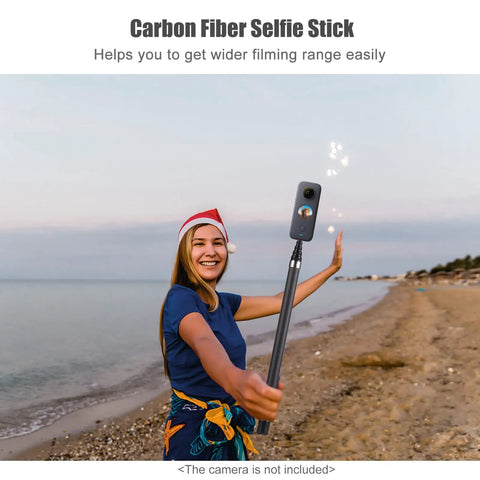 Heavy Duty Carbon Fiber Selfie Stick Extends To Super Long 118 Inches With Reliable 1/4 Inch Mount held by woman on beach.