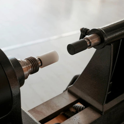 Pen Press Kit For Woodturning Lathes With MT1 Taper, white and black pads aligned on lathe, pro-grade assembly tool