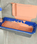 Using a 4 Inch Paint Roller Tray Kit With 22 Pack Liners Thickened Plastic Tray Reusable Gray Tray And 4 Inch Roller Frame on a wall