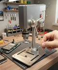 Compact Mini Drill Press Desk Machine Adjustable 12-24V Power Stable Bench Tool With 0.6-6mm Chuck For DIY Workshops setup on workbench.