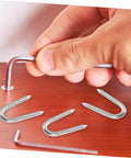 Hand installing 50 Pack U Shaped Fence Staples For Quick Install And Strong Hold Durable Metal Garden Stakes For Fences Landscaping And DIY Projects