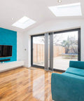 Living room with Seamless 3D Foam Wall And Ceiling Panels Kit, accent wall behind TV, white finish, showcasing modern design.