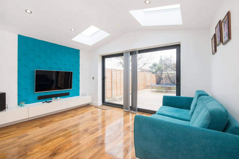 Living room with Seamless 3D Foam Wall And Ceiling Panels Kit, accent wall behind TV, white finish, showcasing modern design.