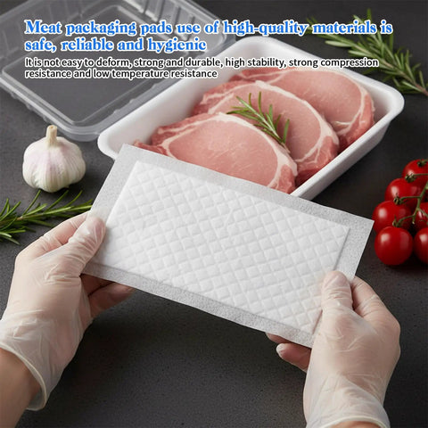 100 Piece Meat Absorbent Pads 4x7 Inch White Food Grade Soaker Pads for Meat and Fish Packaging shown with pork and tomatoes