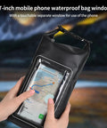 Hands holding 2L Roll Top Waterproof Dry Bag With Integrated Sealed Clear Phone Pouch For Boating Fishing And Travel Heavy Duty Black Dry Pack