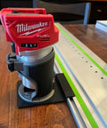 Milwaukee router mounted on a guide rail, detail of Solid As A Rock Guide Rail Adapter Plugs Right Into Milwaukee Router For Smooth Track Saw Setup Makes Knockout Straight Cuts And Clean Dados Uses Factory Sub Base Screws Zero Extra Gear Needed Built Tough In Usa.
