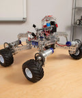 Robotic vehicle with All Terrain Tire Kit For TETRIX MAX Robotics, showing monster truck style wheels and foam inserts for rough surfaces.