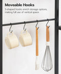 S-hooks on Large Bakers Rack With Power Outlets For Kitchen And Office showing mugs and utensils hanging, space-saving feature