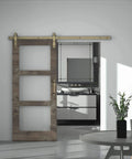 Brass Sliding Barn Door Hardware Kit In Brushed Gold Finish installed on wood door in modern interior
