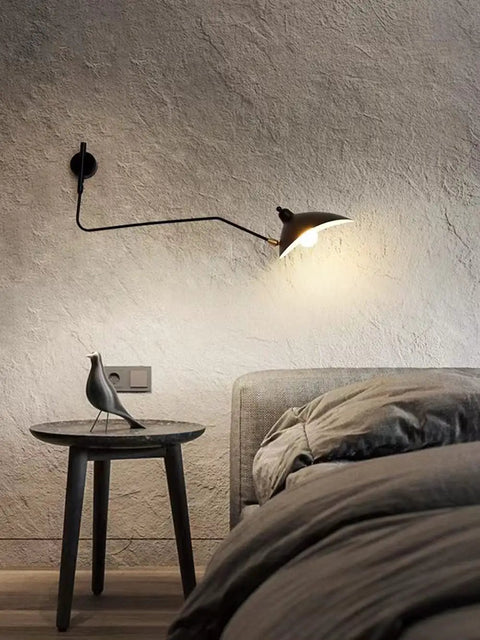 Mid-Century Black Wall Lamp With Industrial Swing Arm Dope Adjustable Wall Mount Lighting illuminating bedside table