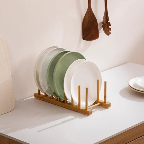 2 Pack Premium Bamboo Dish Rack And Plate Holder With 7 Slots To Level Up Your Kitchen Game displaying plates on countertop.