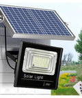 KUSOLE 200W/300W/500W Solar Floodlights & Outdoor Spotlights 300W with solar panel and remote control mounted on wall.