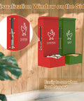 Heavy Duty Metal Chicken Feeder And Oyster Shell Dispenser with visual window, showing red and green hoppers, mounted on a wooden wall.
