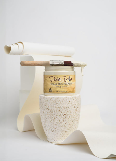 Jar of Chalk Mineral Furniture Paint In Drop Cloth, 32oz, with brush on a neutral background, showcasing matte linen white finish.