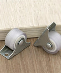 12 Pack One Inch Directional Caster Wheels With Sturdy Flat Plate Base Rolls Smoother Than Butter For Heavy Furniture And Cases Totally Legit Heavy Duty Setup. Close-up of rubber caster wheels with steel plates.